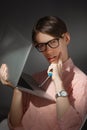 IT computer nerd. Creative teen millenial portrait indoors. Funny young man with happy face expression in glasses hug