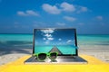 Computer notebook on beach - business travel background Royalty Free Stock Photo