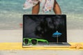 Computer notebook on beach - business travel background Royalty Free Stock Photo