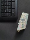 computer numeric keypad and Czech money on the black table