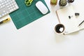 Computer and office supplies with coffee and cactus on table, Above workspace office desk top view