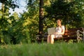 Computer outdoor. Student girl working on laptop, tablet in summer park. Woman person business nature outside with Royalty Free Stock Photo