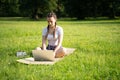 Computer outdoor. Student girl working on laptop, tablet in summer park. Woman person business nature outside with