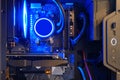Computer parts inside pc with ice blue led liquid cooling