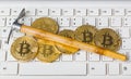 Computer and pickaxe on bitcoins Royalty Free Stock Photo