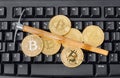 Computer and pickaxe on bitcoins Royalty Free Stock Photo