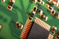 Computer processor chip on a circuit board with microchips and other electronic parts CPU Chip on Motherboard Royalty Free Stock Photo