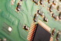 Computer processor chip on a circuit board with microchips and other electronic parts CPU Chip on Motherboard Royalty Free Stock Photo