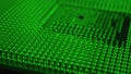Computer processor close up. Dark green tinted background or backdrop. Information technology wallpaper. A pattern of contacts and Royalty Free Stock Photo