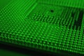 Computer processor close up. Dark green tinted background or backdrop. Information technology wallpaper. A pattern of contacts and Royalty Free Stock Photo