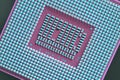 Computer processor close up. Light blue and pink tinted background or backdrop. Wallpaper on the theme of information technology. Royalty Free Stock Photo