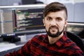 Computer programmer developer working in IT office, sitting at desk and coding, working on a project in software Royalty Free Stock Photo