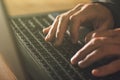 Computer programmer and hacker hands typing laptop keyboard