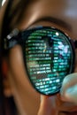Computer programmer studying big data with eyeglasses on, analyzing information on screen Royalty Free Stock Photo