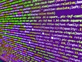 Computer programming source code. Blurred screen with selective focus. Software data monitor new function. Close up of random