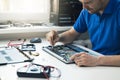 Computer repair service - technician repairing broken laptop Royalty Free Stock Photo