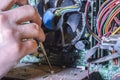 Computer repair, technician equipment. Hand repairs closeup
