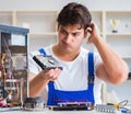 Computer repairman repairing desktop computer Royalty Free Stock Photo