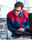 Computer repairman working on repairing computer in IT workshop Royalty Free Stock Photo
