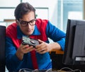 Computer repairman working on repairing computer in IT workshop Royalty Free Stock Photo