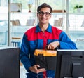 Computer repairman working on repairing computer in IT workshop Royalty Free Stock Photo