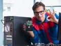Computer repairman working on repairing computer in IT workshop Royalty Free Stock Photo