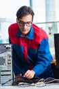 Computer repairman working on repairing computer in IT workshop Royalty Free Stock Photo