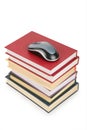 Computer`s mouse on pile of books Royalty Free Stock Photo