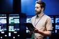 Computer scientist monitors server racks