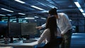 Computer scientists in data center managing and maintaining databases