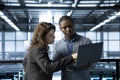 Computer scientists in data center use notebook, integrating green technologies