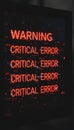 Computer screen displaying critical error message with digital glitch Royalty Free Stock Photo