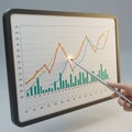 A computer screen displays a graph with multiple data sets in various colors: red, Royalty Free Stock Photo