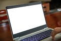 Computer screen mockup. Laptop with white blank screen on a wood desk, office background, copy space Royalty Free Stock Photo