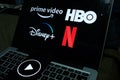 Computer screen with the Netflix logo, Prime Video, HBO and Disney plus.