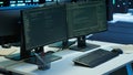 Computer screens on desk in advanced server hub