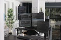 Computer screens showing parsing html code in empty it office