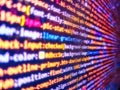 Computer script coding source code on desktop monitor. Innovative startup project. Admin access to data. Mobile app developer. Web