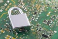 Computer security concept. Padlock on green computer circuit board Royalty Free Stock Photo