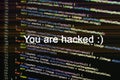 Program code with hacked alert. Glitch effect added Royalty Free Stock Photo