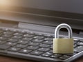 Computer security concept. Unlocked padlock on laptop keyboard. Symbol of safe. Toned soft focus picture