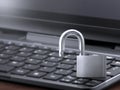 Computer security concept. Unlocked padlock on laptop keyboard. Symbol of safe. Toned soft focus picture Royalty Free Stock Photo