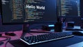 Computer setup featuring dual monitors displaying colorful code and a prominent 'Hello World' message, with a sleek Royalty Free Stock Photo