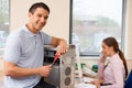 Computer IT Support Worker Fixing Machine In Office Royalty Free Stock Photo