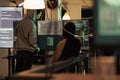 Computer system cyberattack, malware code on screen