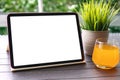 computer tablet with isolated screen background table orange juice cafe Royalty Free Stock Photo