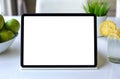 computer tablet with isolated screen background white table in cafe Royalty Free Stock Photo