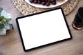 Computer tablet with isolated screen on table in cafe Royalty Free Stock Photo