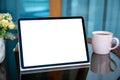 computer tablet with isolated screen on a table in cafe Royalty Free Stock Photo