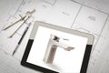 Computer Tablet Showing Custom Faucet On House Plans, Pencil, Compass